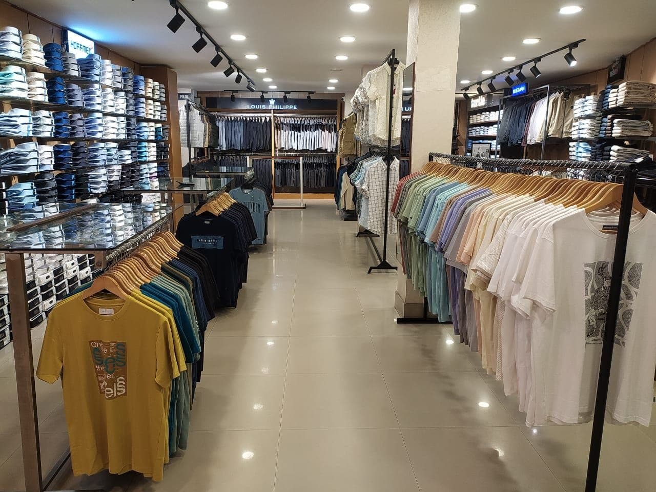 The menswear aisle at K.A.K, Kohima, brand bays on both sides