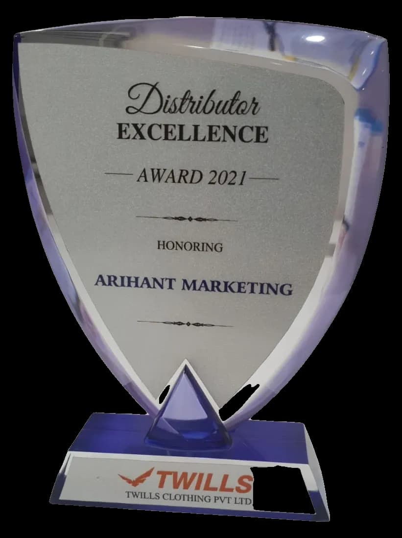 Twills Clothing Distributor Excellence Award 2021 honouring Arihant Marketing: a shield in blue acrylic on a blue base