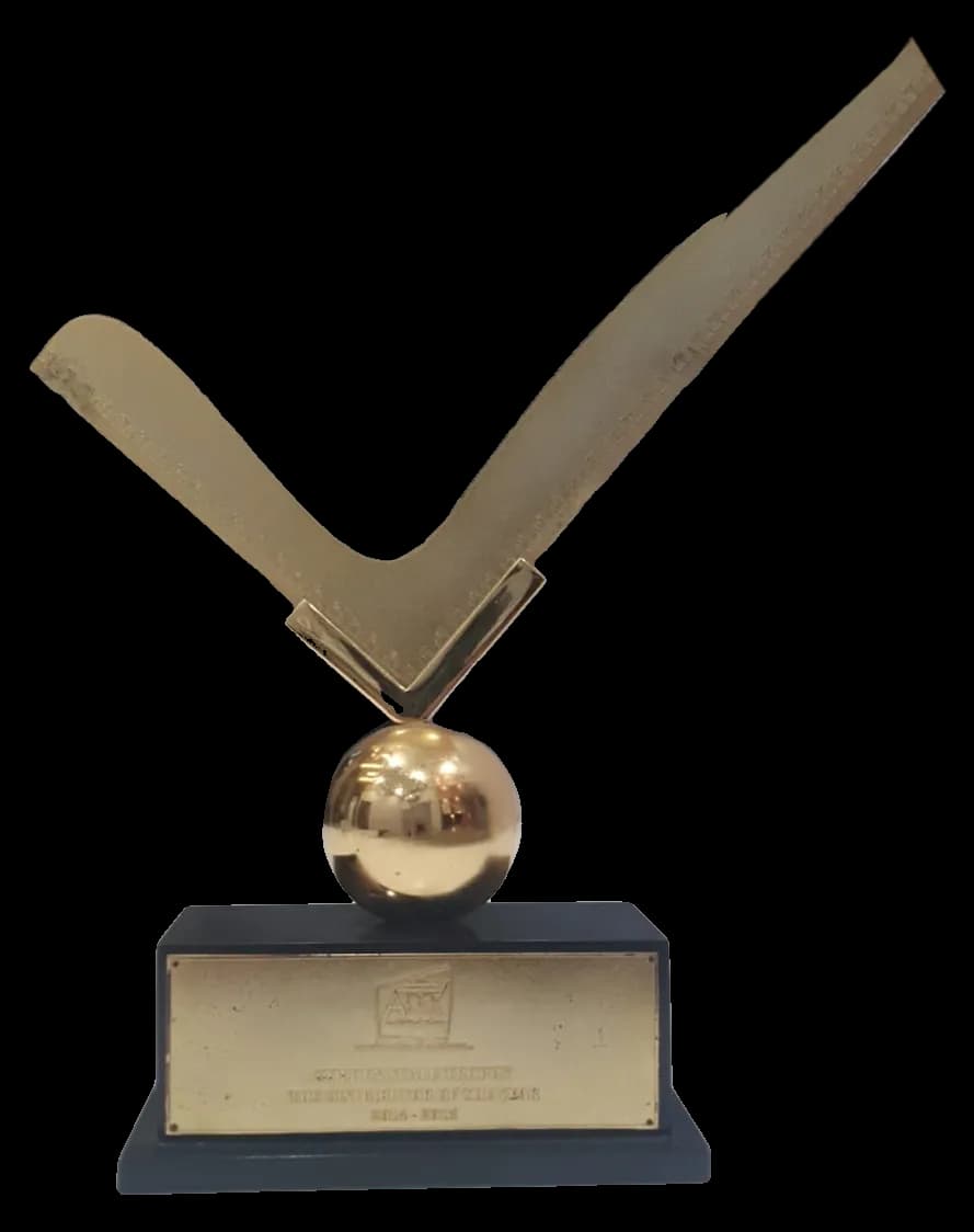 The Golden Star Seller Distributor of the Year trophy presented to Arihant Marketing: a gold tick on a gold sphere over a black base