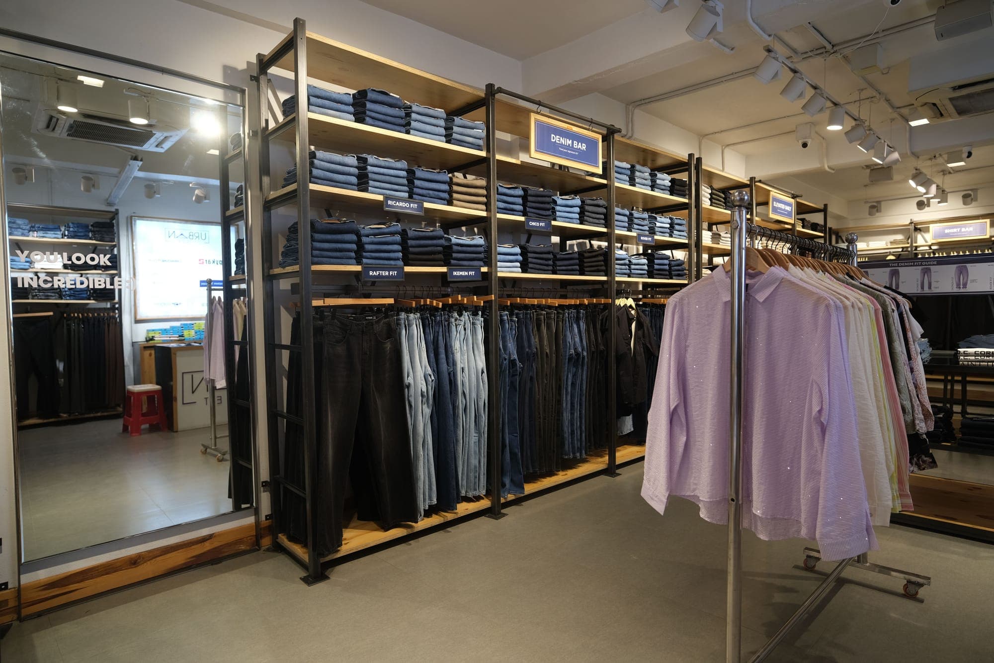 Tanzee, Itanagar: inside, the shirt and denim bays under track lights.